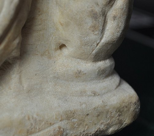 Detail showing the anomalous drill hole at the base of the baluster on the proper left side of Cinerary Urn (late 1st/early 2nd century A.D.). The Art Institute of Chicago, 1926.621a–b.