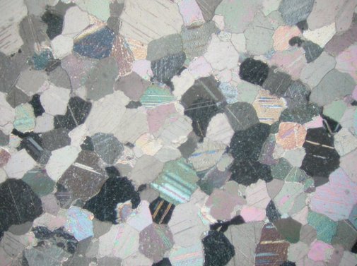 Photomicrograph (crossed polars, image width = 2.55 mm) of the petrographic thin section of the stone from the body of Cinerary Urn (late 1st/early 2nd century A.D.). The Art Institute of Chicago, 1926.621a–b.