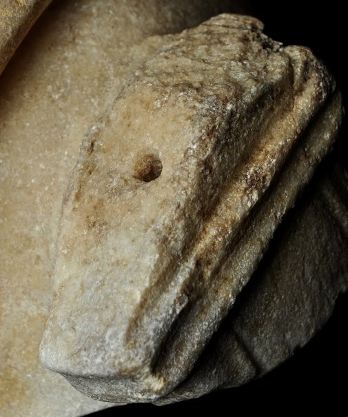 Roman Art | Online Scholarly Catalogue | Art Institute of Chicago | Detail showing the hole on the top of the scabbard of Fragment of a Portrait Statue of a Man (2nd century A.D.). 