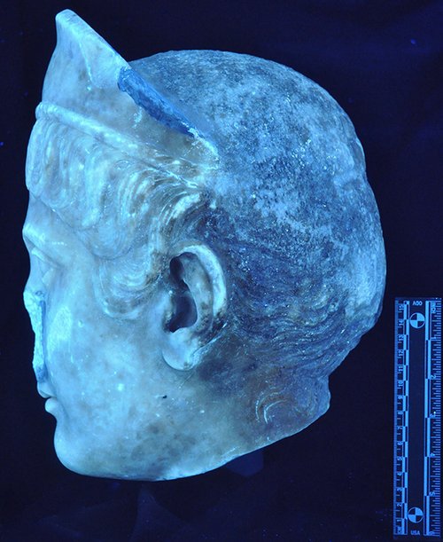 Ultraviolet image of Portrait Head of a Woman (A.D. 117/38) showing the difference in color between the reworked stone on the back of the head and the original surface of the face. The Art Institute of Chicago, 1962.926.