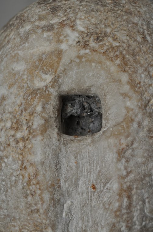 Detail showing the lead embedded in the square cavity in the back of the head of Portrait Head of a Woman (A.D. 117/38). The Art Institute of Chicago, 1962.926.
