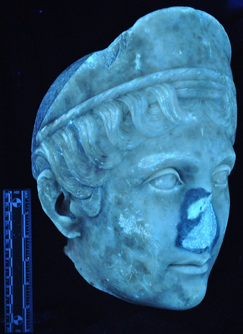 Ultraviolet image of Portrait Head of a Woman (A.D. 117/38) showing the previous damage and overpainting around the nose. The Art Institute of Chicago, 1962.926.