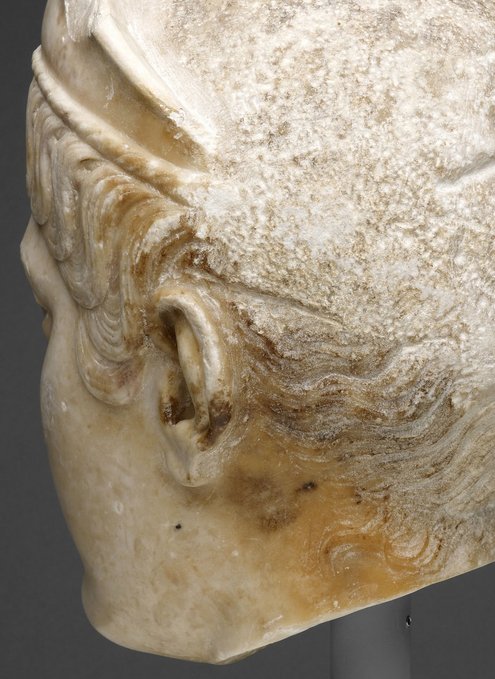 Detail of Portrait Head of a Woman (A.D. 117/38) showing the pronounced orange patina along the proper left side. The Art Institute of Chicago, 1962.926.