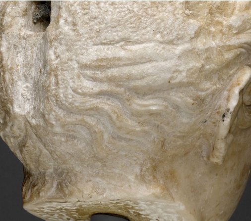 Detail of Portrait Head of a Woman (A.D. 117/38) showing the remnants of curls at the base of the neck on the proper right side. The Art Institute of Chicago, 1962.926.