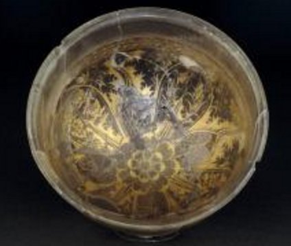 Roman Art | Online Scholarly Catalogue | Art Institute of Chicago | Hellenistic, perhaps made in Alexandria, found in Canosa, Italy.  Bowl, c. 210/160 B.C. Sandwich Gold glass with a floral design in gold leaf sandwiched between two layers of clear glass.