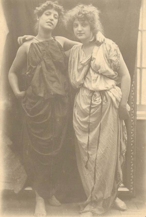 Edward Linley Sambourne (English, 1844–1910). Hetty and Lilly Pettigrew in studio   drapery – get title from RBK&C), c. 1891 (cf lender). Platinum bromide photograph on   paper (confirm); 448 × 640 mm.
